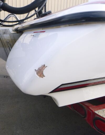 Boat damage from collision before repairs
