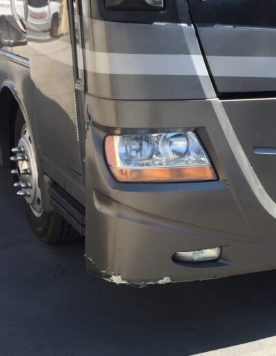 RV front bumper damage from impact